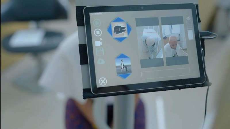 A 3D scan of a client’s head shown on a tablet during cranial mapping